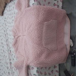 A pink sweater size 10
